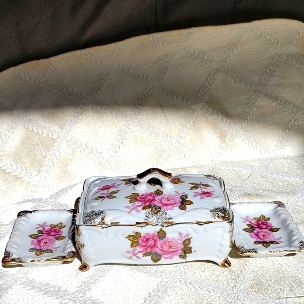 Cigarette box and ash trays.